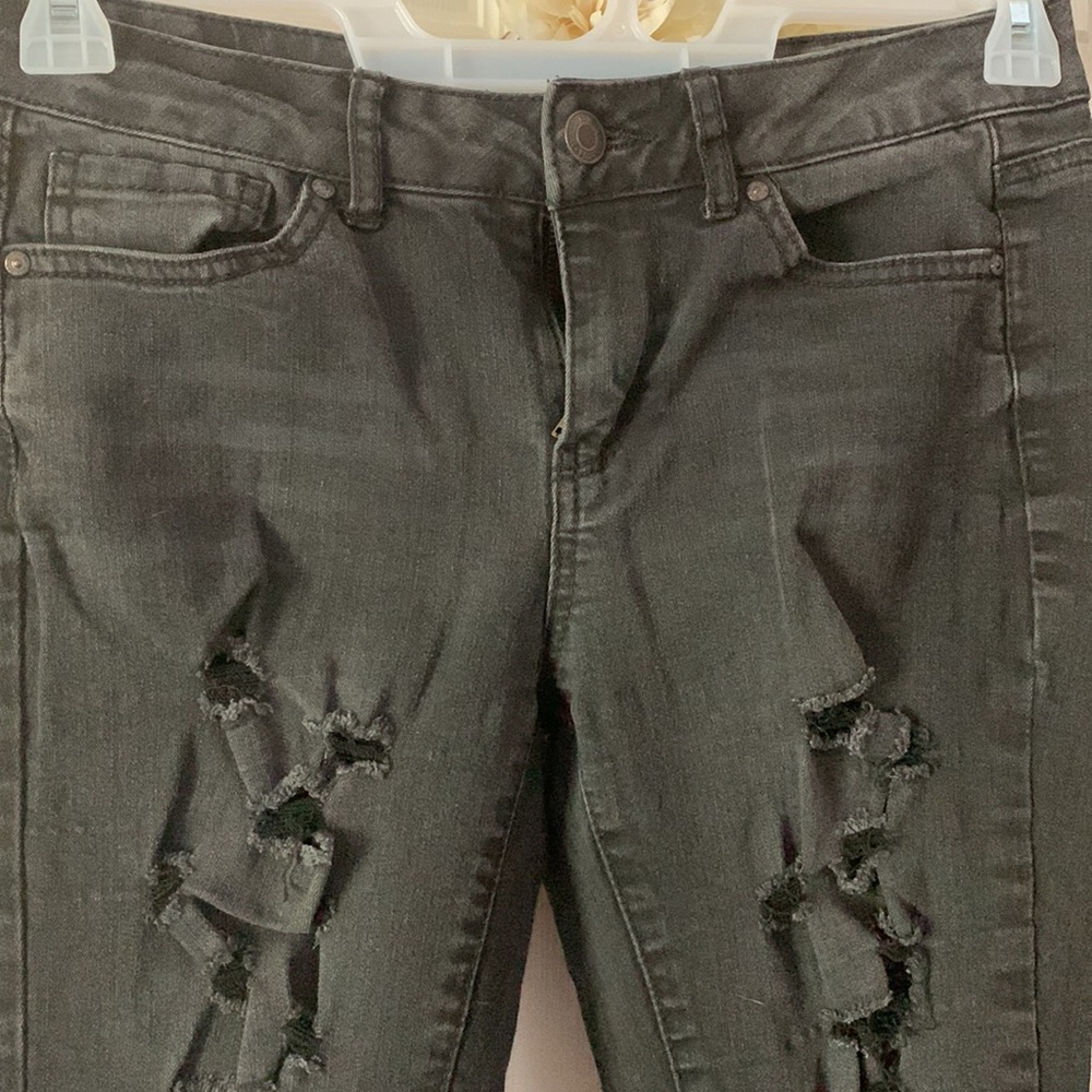 Black denim stretchy, medium wash, frayed, ripped, size 7, lower waist.